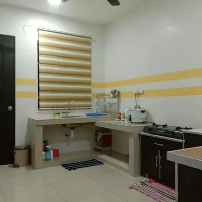 a kitchen with a sink and a window in it at TRIPLE A Homestay in Ipoh