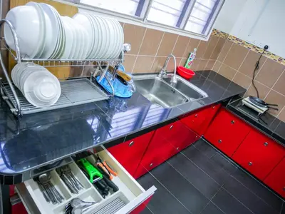 a kitchen with a sink and a counter top at Gather Here 62 5BR Town Center 5 Rooms in Taiping