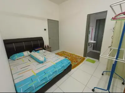 a bedroom with a large bed and a bathroom at HM Homestay Lahat, Station 18, Ipoh 'مسلم' in Lahat
