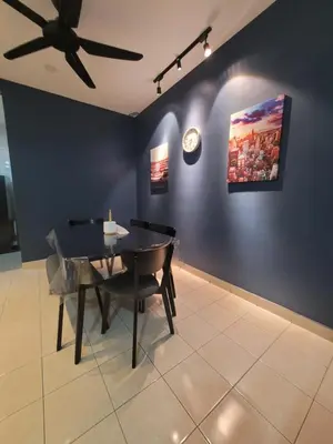 a dining room with a table and a ceiling fan at Ipoh Meru Modern Cozy Home NAZ IPOH HOMESTAY in Ipoh