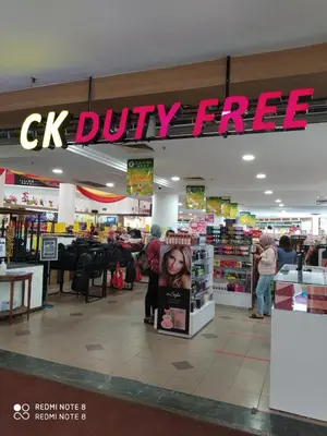 a store with a ck injury free sign in a store at Pangkor fun fun fun apartment in Pangkor