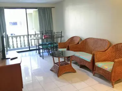 a waiting room with chairs and tables and a balcony at Pangkor fun fun fun apartment in Pangkor