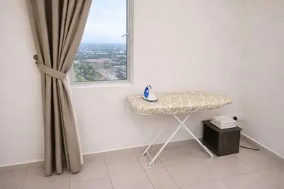 a room with a table in front of a window at The Venus Sitiawan Breezee Spacious Homestay 6 to 8 Pax in Kampong Lumut Kiri