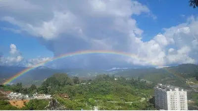 a rainbow in the sky over a city at Kensington Sunrise at Sg Palas,PalasHorizon in Tanah Rata