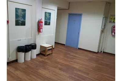 a room with a blue door and a wooden floor at Madani Muslim Hotel Cameron Highland in Cameron Highlands