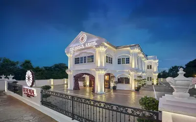 a large white building with a fence in front of it at Seriental Hotel I check in 3pm-11pm only in Tanjong Tokong
