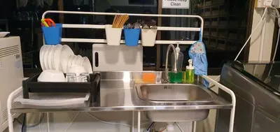 a kitchen counter with a sink and utensils at Room at Lebuh Armenian Georgetown City Center in George Town