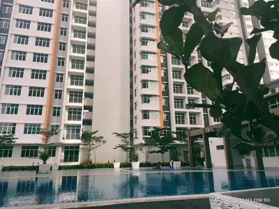 a view of two tall apartment buildings with a swimming pool at HOMESTAY NazIPOH Meru in Ipoh