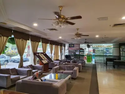 a large living room with couches and a ceiling fan at Pangkor Coral Bay Resort(2 bedrooms) in Pangkor