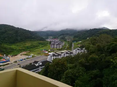 a view from a balcony of a city with a mountain at Crown Imperial Court Apt at Brinchang Centre in Brinchang