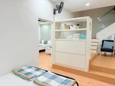 a room with a white partition with a bed in it at Ocean 19 Shamrock Villa Beachfront Big Group 4 Bedroom 5 Bathroom with Pool in Tanjung Bungah