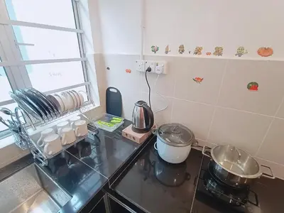 a kitchen with a stove and some pots and pans at FuYoke Emerald Avenue @ Brinchang in Cameron Highlands