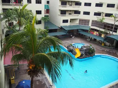 an overhead view of a large swimming pool in a hotel at Pangkor Coral Bay Resort(3 bedrooms) \u4f11\u606f\u5c0f\u7ad9 in Pangkor