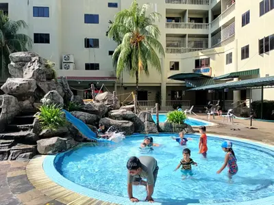 a group of children playing in a pool at a hotel at Pangkor Coral Bay Resort(3 bedrooms) \u4f11\u606f\u5c0f\u7ad9 in Pangkor