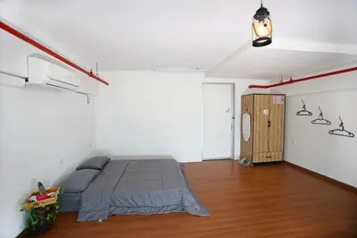 a bedroom with a bed in a room at Private Forest Camp - Cinema, Hammock, Swing at CEO Penang in Bayan Lepas