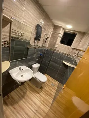 a bathroom with a toilet and a sink at EagleNest at Marina Cove Resort in Lumut