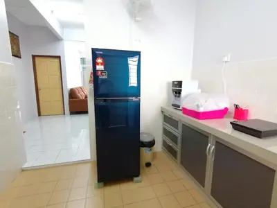 a blue refrigerator in a kitchen with a counter at YITOM Homestay\u6613\u901a\u6c11\u5bbf in Sungai Besar