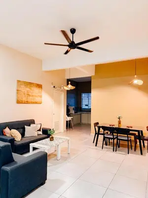 a living room with a couch and a table at Golden Sweet Home @ Golden Hills (Night Market, \u591c\u5e02) in Tanah Rata