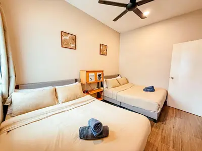 a bedroom with two beds and a ceiling fan at Golden Sweet Home @ Golden Hills (Night Market, \u591c\u5e02) in Tanah Rata