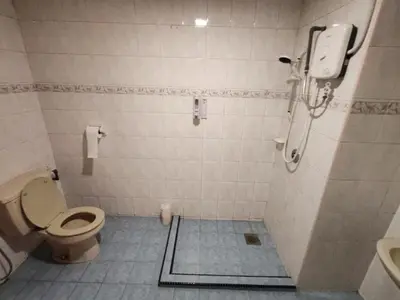 a bathroom with a toilet and a sink at Amy Home Moonlight Apartment, Cameron Highlands in Brinchang
