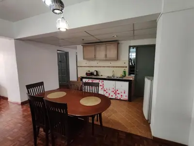 a kitchen with a table and chairs in a room at Amy Home Moonlight Apartment, Cameron Highlands in Brinchang