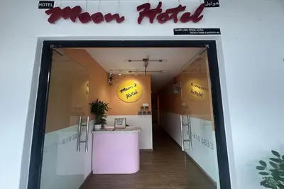a door into a room with a moon hotel sign at Moon Hotel, Cameron Highlands in Brinchang