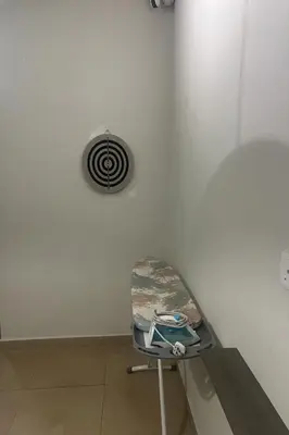 a chair in a room with a vent at Moon Hotel, Cameron Highlands in Brinchang