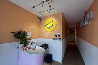 an office with a counter and a yellow sign on the wall at Moon Hotel, Cameron Highlands in Brinchang