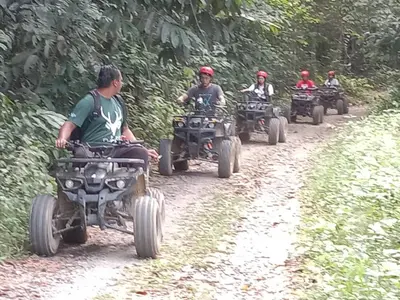 a group of people riding atvs down a dirt road at Branda Kampung Sumpitan Lenggong TIADA SUNGAI in Kampong Ulu Jepai
