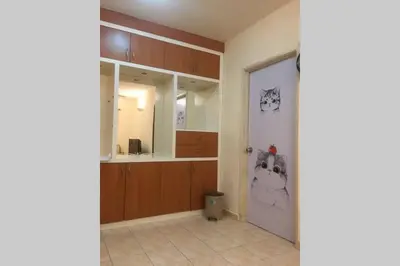 a room with a bathroom with a door with cats on it at Tambun homestay in Ipoh