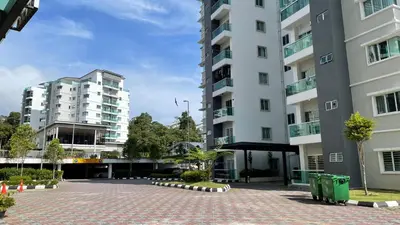 a courtyard in front of two tall buildings at The Quintet Cameron Highlands by Tulip in Tanah Rata