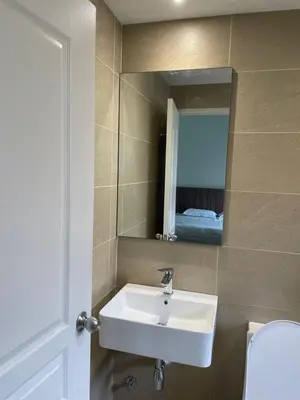a bathroom with a sink and a mirror and a toilet at The Quintet Cameron Highlands by Tulip in Tanah Rata