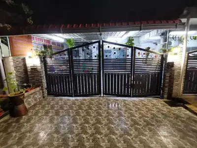 an entrance to a building with a black gate at MN HOMES in Ipoh