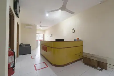 a lobby with a yellow counter in a room at Guesthouse Fasa 2B in Seri Manjung