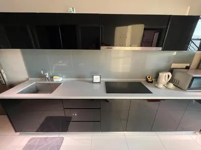a kitchen with a sink and a microwave at Maritime Seaview Hotel by SS Setia Resort in George Town