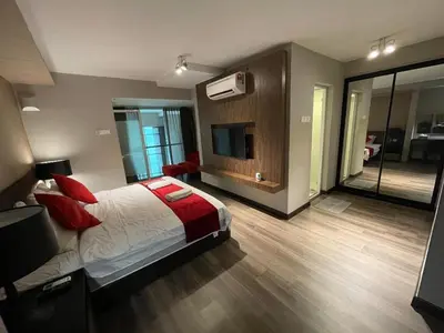 a bedroom with a bed and a television in it at Maritime Seaview Hotel by SS Setia Resort in George Town