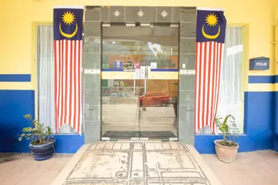an entrance to a gas station with the door open at Sun Inns Tambun in Kampong Batu Lapan