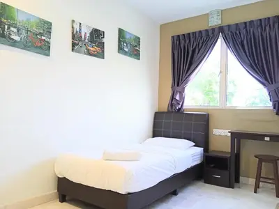 a small bedroom with a bed and a window at Ipoh Comfortable Rooms Only-Private Bathrooms Indoor Car Parking SY30 in Ipoh
