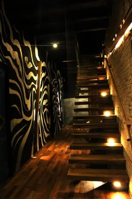a staircase in a room with a wall and a stair case at The Happy 8 Retreat @ Old Town Ipoh in Ipoh