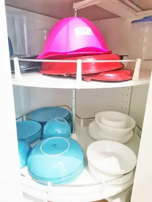 a bunch of plates and bowls on a shelf at Grand Meritus Homestay @Penang in Perai