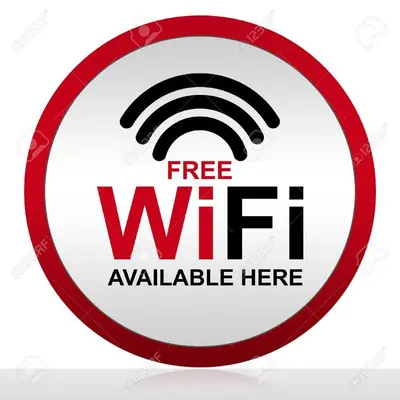 a red and white sign that reads free wifi available here at No 96 Nazirin Homestay Lumut in Lumut
