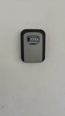 a black and white remote control on a wall at No 96 Nazirin Homestay Lumut in Lumut
