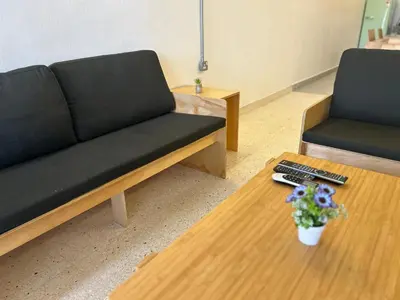 a living room with a couch and a coffee table at Garden Home Ipoh in Ipoh