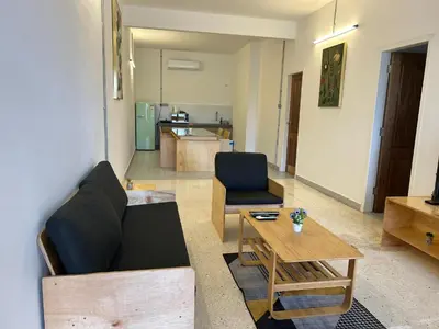 a living room with a couch and a table at Garden Home Ipoh in Ipoh