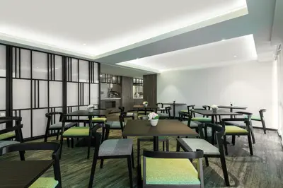 a restaurant with tables and chairs in a room at Citadines Prai Penang in Bukit Mertajam