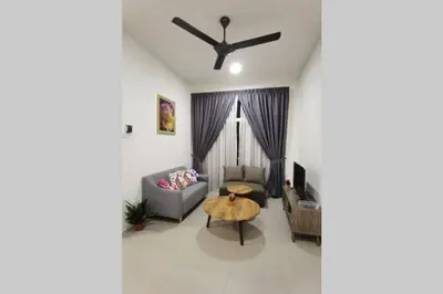 a living room with a couch and a table at W58 WarmStay atGoldenHill NightMarket 2R WiFi CarPark in Tanah Rata