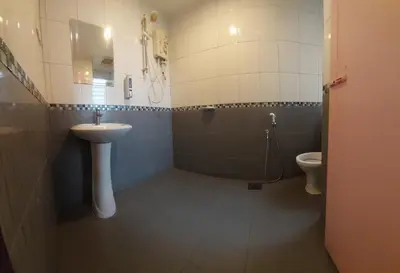 a bathroom with a sink and a toilet at RELAX HOTEL in Sungai Petani