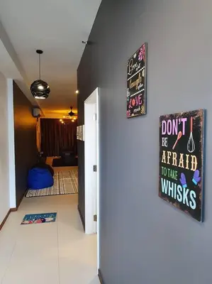 a hallway with a dont be afraid to have whiskes sign on a wall at Landmark By Katana 3BR Glamorous Highrise Seaview Homestay Gurney\u65e0\u654c\u6d77\u666f\u4e09\u623f\u5957\u623f in Tanjong Tokong