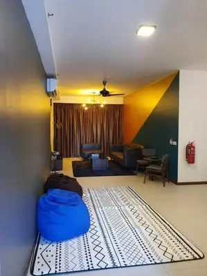 a living room with a blue bag on the floor at Landmark By Katana 3BR Glamorous Highrise Seaview Homestay Gurney\u65e0\u654c\u6d77\u666f\u4e09\u623f\u5957\u623f in Tanjong Tokong