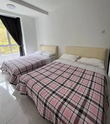 two beds sitting next to each other in a room at Cameron Emerald Avenue 2 @ Brinchang in Brinchang